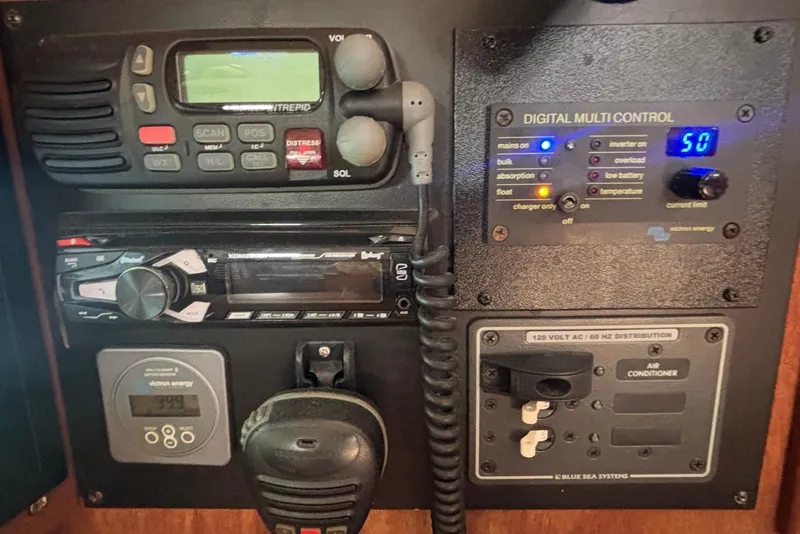 Slide: The Image of Control panel of a 2002 Island Packet 380 sailboat with radio and digital controls. - 19