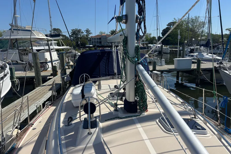 Slide: The Image of Sailboat docked at marina, Island Packet 380, 2002 model, with clear blue sky. - 27