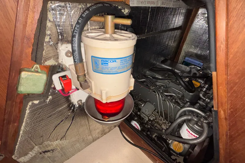 Slide: The Image of Engine compartment of a 2002 Island Packet 380 sailboat with Racor fuel filter. - 39