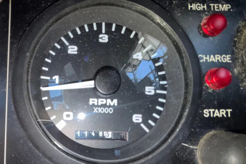 Slide: The Image of Tachometer of 2002 Island Packet 380 sailboat showing RPM and indicator lights. - 43