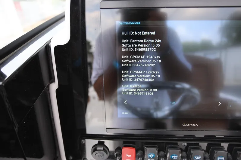 Slide: The Image of Garmin marine display on 2024 Sea Hunt Ultra 275 SE showing device software versions. - 19