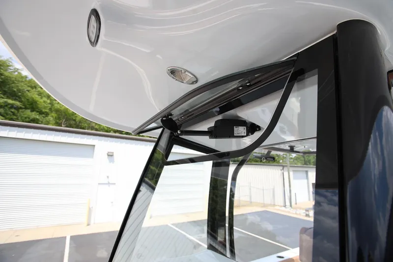 Slide: The Image of 2024 Sea Hunt Ultra 275 SE boat canopy and windshield detail. - 22