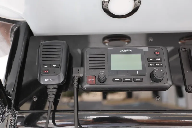 Slide: The Image of Garmin marine radio system on 2024 Sea Hunt Ultra 275 SE boat dashboard. - 25