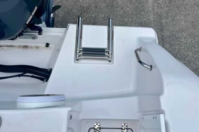 Slide: The Image of 2023 Sportsman Open 232 Center Console boat ladder and deck details. - 12