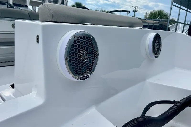Slide: The Image of 2023 Sportsman Open 232 Center Console boat speakers and seating detail. - 13