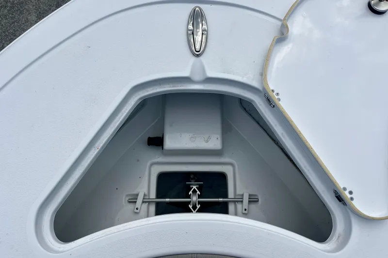 Slide: The Image of 2023 Sportsman Open 232 Center Console anchor storage compartment, open lid view. - 17