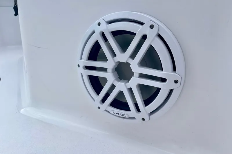 Slide: The Image of White JL Audio speaker on 2023 Sportsman Open 232 Center Console boat. - 27