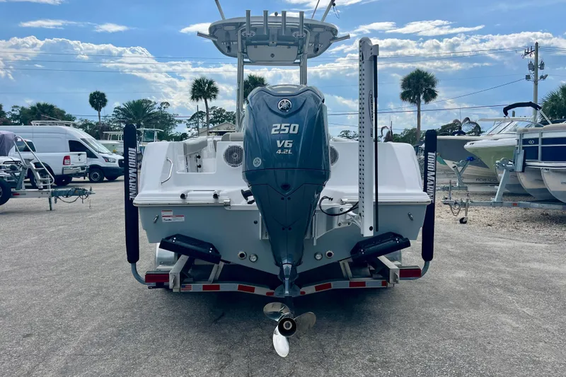 Slide: The Image of 2023 Sportsman Open 232 Center Console boat with Yamaha 250 V6 engine, parked outdoors. - 5