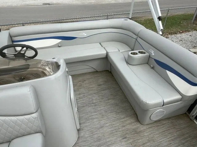 Slide: The Image of Interior of a 2021 Bennington 168 SLV pontoon boat with gray seating. - 4