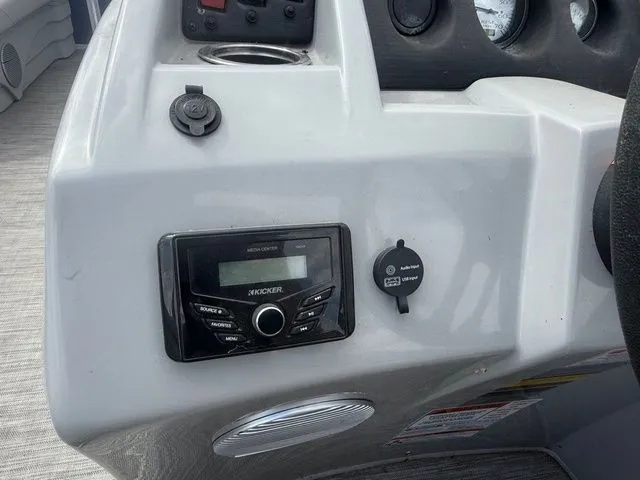 Slide: The Image of Dashboard of a 2021 Bennington 168 SLV with Kicker audio system. - 6