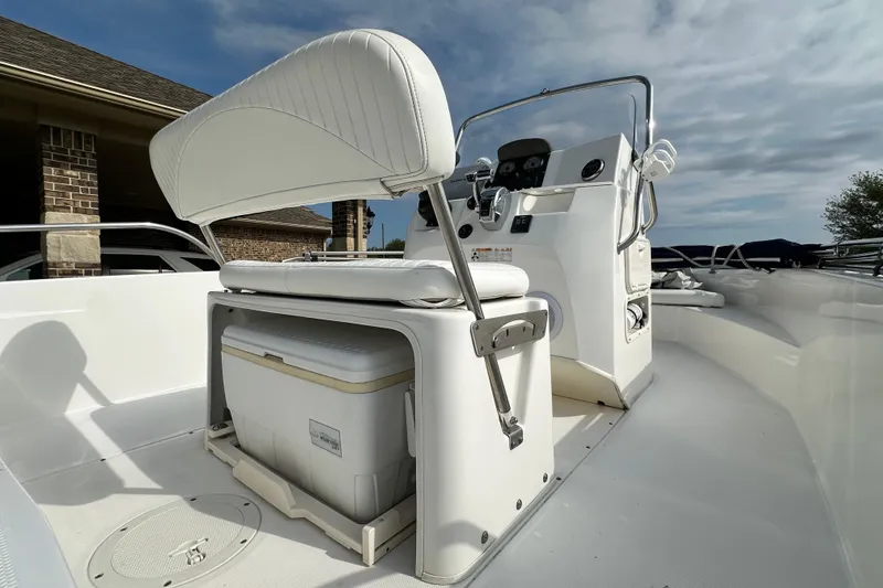 Slide: The Image of 2008 Boston Whaler 180 Dauntless boat interior with helm and seating area. - 13