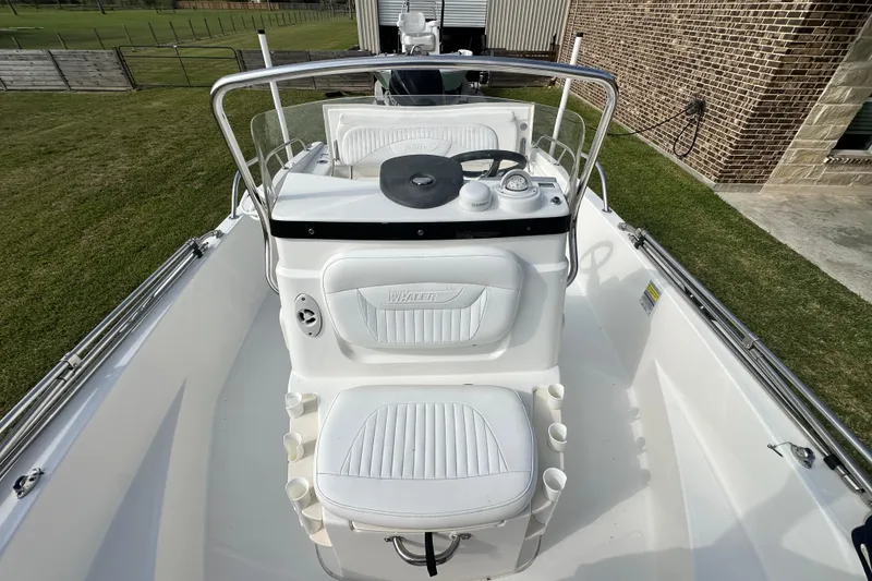 Slide: The Image of 2008 Boston Whaler 180 Dauntless boat interior with steering console and seating. - 30