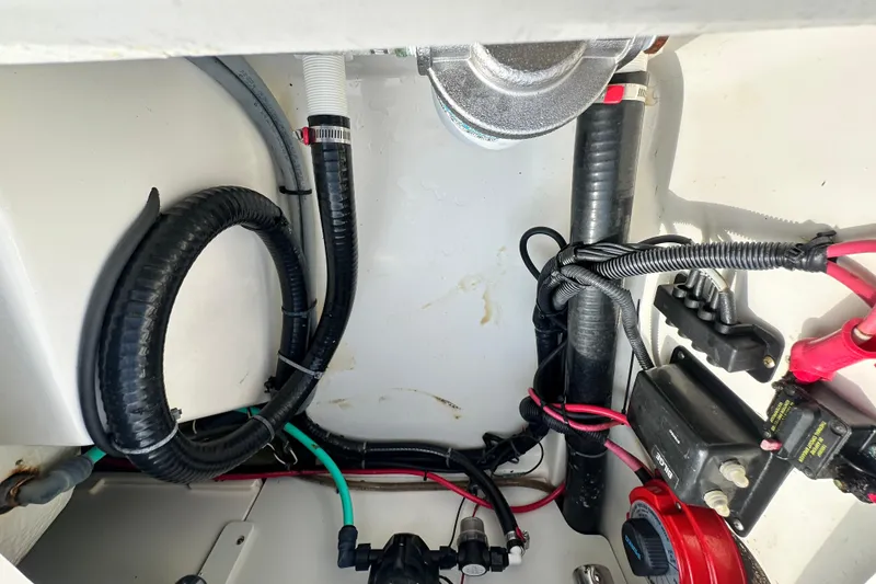 Slide: The Image of Electrical and mechanical components inside a 2008 Boston Whaler 180 Dauntless boat. - 40