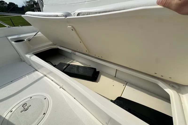 Slide: The Image of Open storage compartment on a 2008 Boston Whaler 180 Dauntless boat. - 44