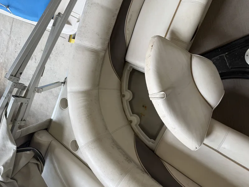 Slide: The Image of Interior of a 2003 Premier 270 Grand Majestic boat with white seating. - 13