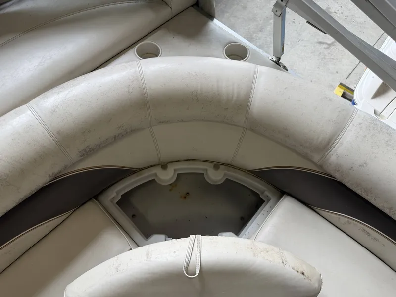 Slide: The Image of Interior of a 2003 Premier 270 Grand Majestic boat with worn seating. - 14