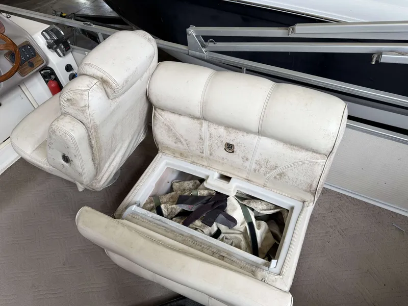 Slide: The Image of Interior of a 2003 Premier 270 Grand Majestic boat with storage compartment. - 16