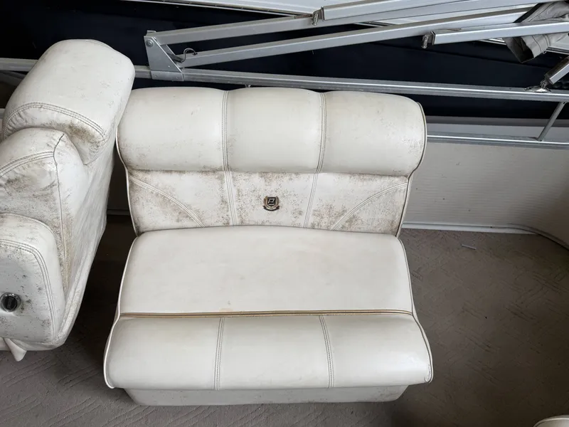 Slide: The Image of Worn white seats of a 2003 Premier 270 Grand Majestic. - 17