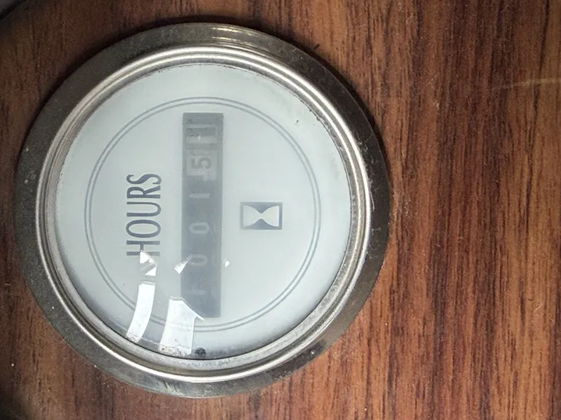 Slide: The Image of Hour meter on wood paneling, displaying 151 hours. - 20