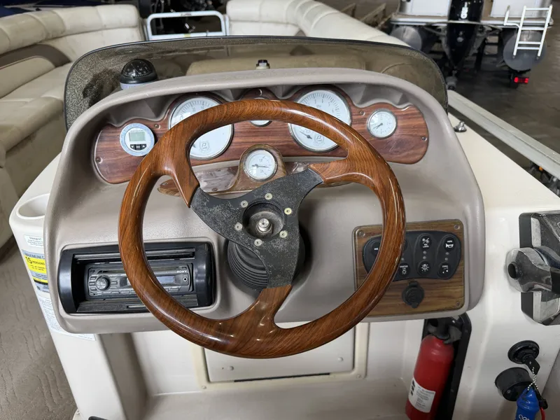 Slide: The Image of Steering console of a 2003 Premier 270 Grand Majestic boat. - 22