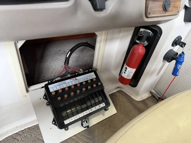 Slide: The Image of Control panel of a 2003 Premier 270 Grand Majestic with fire extinguisher. - 26