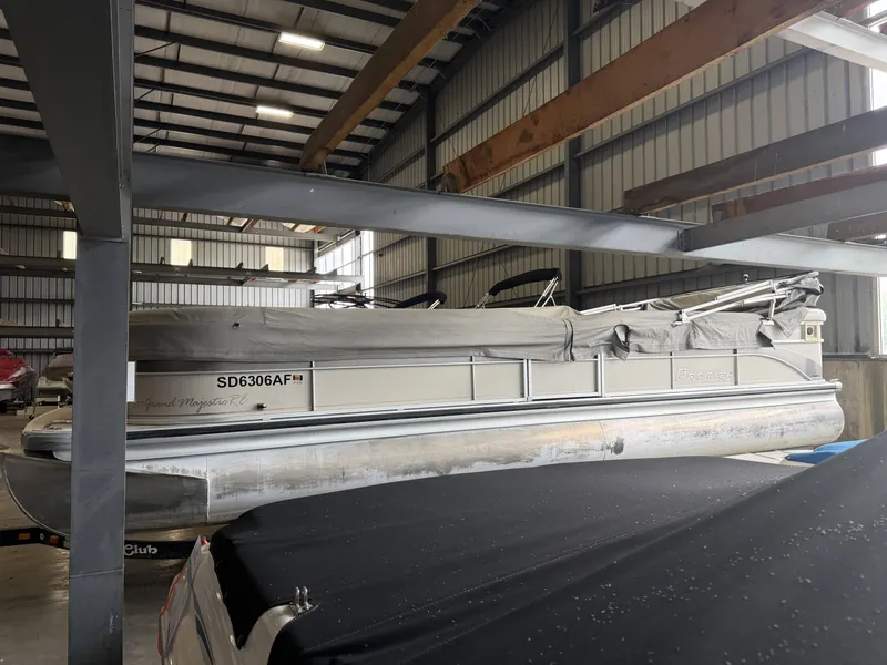 Slide: The Image of 2003 Premier 270 Grand Majestic pontoon boat in storage facility. - 4