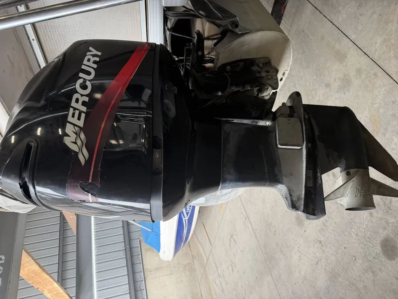 Slide: The Image of Mercury outboard motor on a 2003 Premier 270 Grand Majestic. - 6