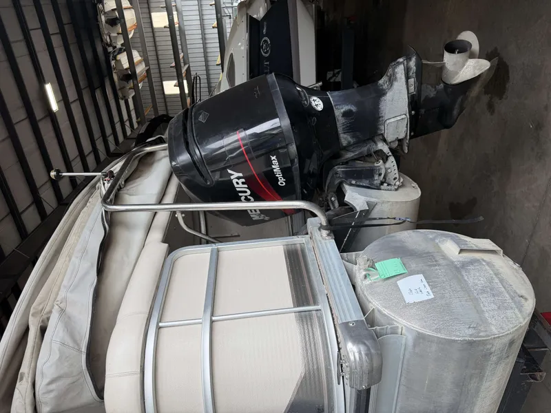Slide: The Image of 2003 Premier 270 Grand Majestic with Mercury outboard motor in storage facility. - 7