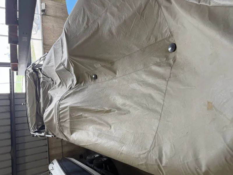 Slide: The Image of Covered Premier 270 Grand Majestic boat from 2003 in storage facility. - 9