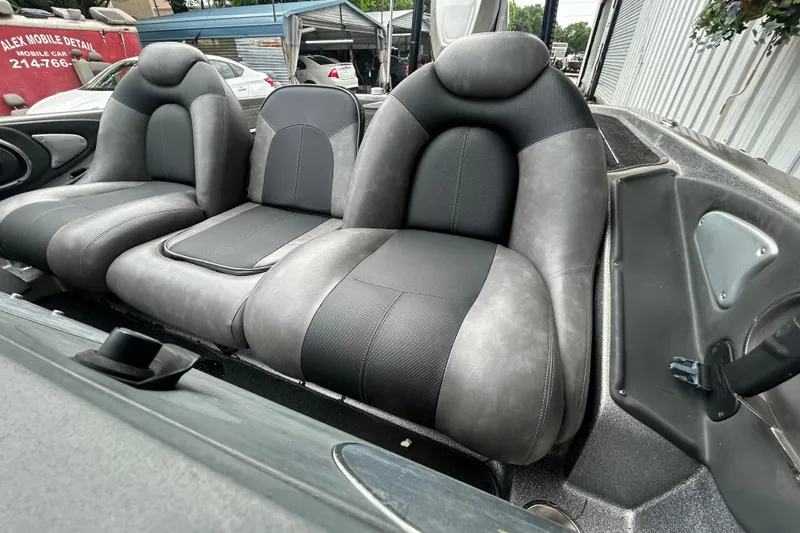 Slide: The Image of 2008 Ranger Z22 Comanche boat logo with metallic finish and red accents. - 10