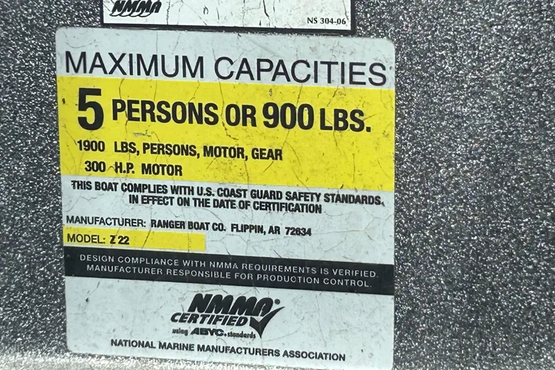 Slide: The Image of 2008 Ranger Z22 Comanche boat interior with gray and black seating. - 12