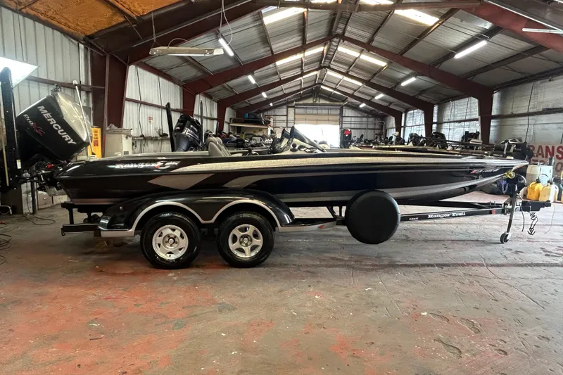 Slide: The Image of 2008 Ranger Z22 Comanche boat at Crans Auto Sales, rear view with motor and propeller. - 6