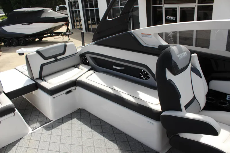 Slide: The Image of 2020 Yamaha Boats 275SE interior with sleek seating and modern design. - 12