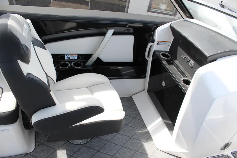 Slide: The Image of Interior of 2020 Yamaha Boats 275SE, featuring sleek seating and modern dashboard design. - 13