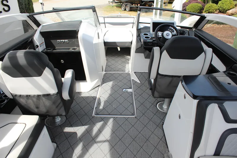 Slide: The Image of 2020 Yamaha Boats 275SE interior with modern seating and sleek dashboard design. - 15
