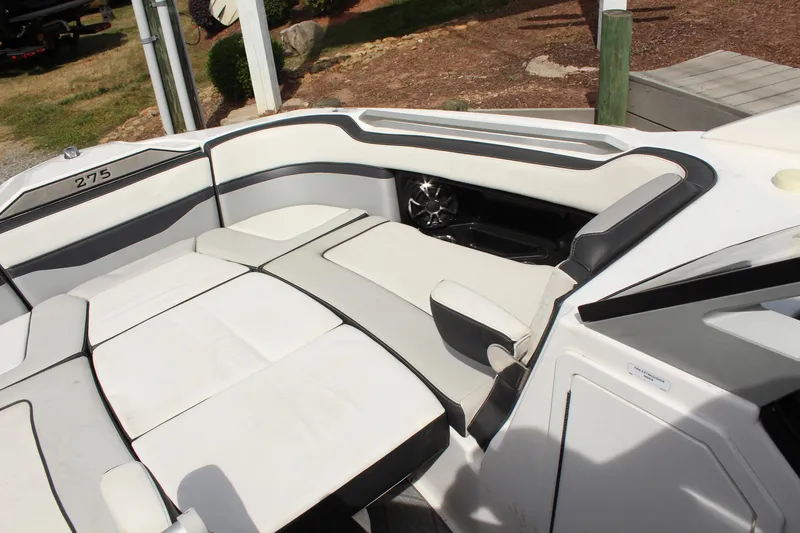 Slide: The Image of 2020 Yamaha Boats 275SE interior with white and gray seating, showcasing luxury design. - 18