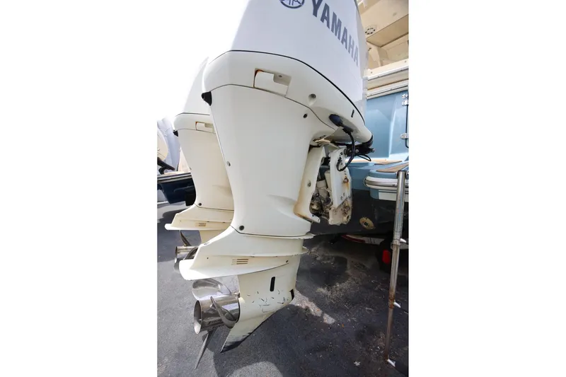 Slide: The Image of 2018 Scout 300 LXF with Yamaha outboard motor, showcasing powerful marine engineering. - 11