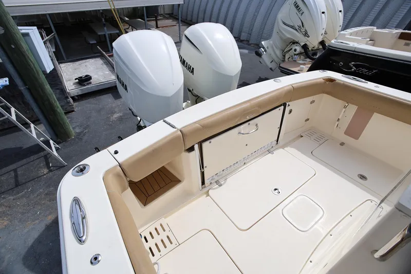 Slide: The Image of 2018 Scout 300 LXF boat deck with Yamaha outboard engines. - 13