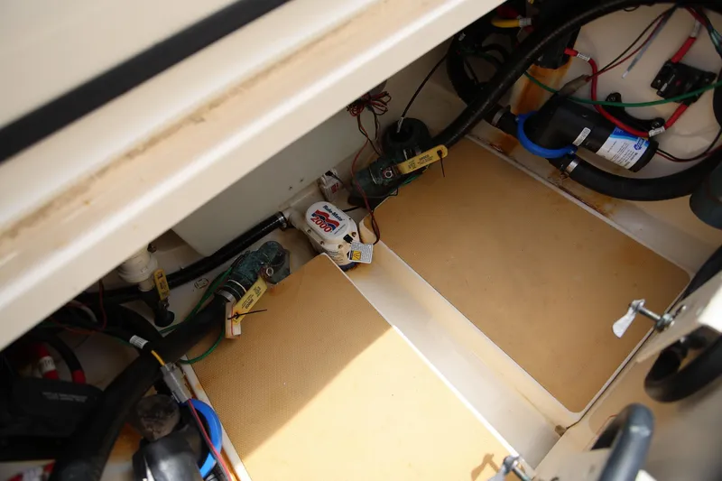 Slide: The Image of 2018 Scout 300 LXF boat interior showing wiring and mechanical components. - 15