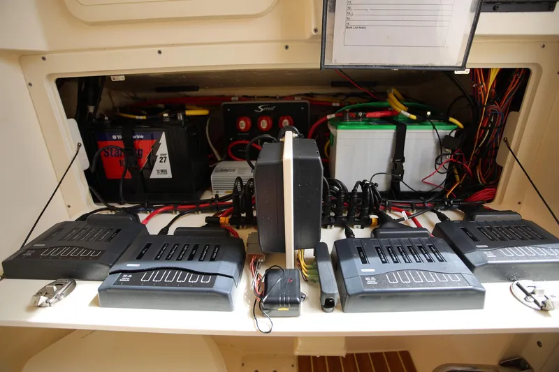 Slide: The Image of Electrical system setup in a 2018 Scout 300 LXF boat, featuring batteries and wiring. - 30