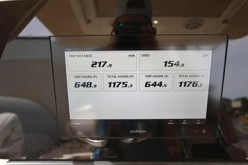 Slide: The Image of Garmin display showing trip data on a 2018 Scout 300 LXF boat. - 32
