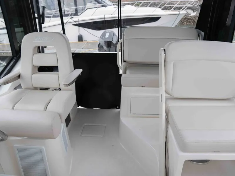 Slide: The Image of Interior of 2026 Boston Whaler 325 Conquest with luxurious seating. - 10