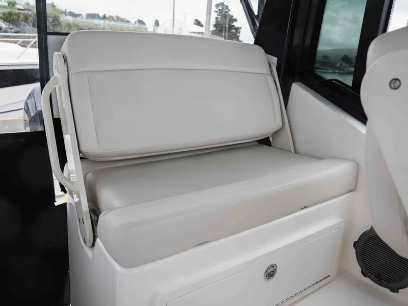 Slide: The Image of Interior of 2026 Boston Whaler 325 Conquest with white seating. - 13