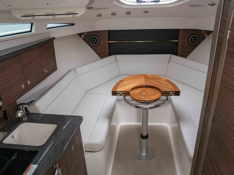 Slide: The Image of Interior of 2026 Boston Whaler 325 Conquest with elegant seating area. - 16