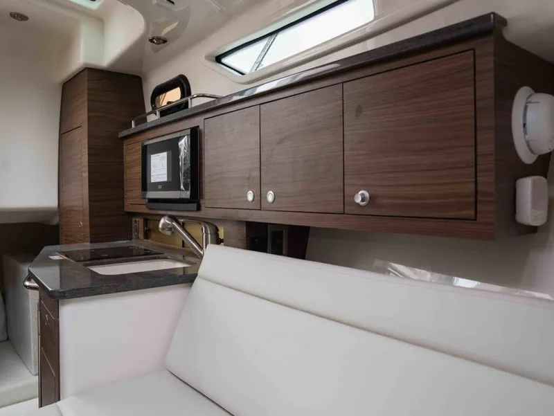 Slide: The Image of Interior of 2026 Boston Whaler 325 Conquest featuring modern kitchen. - 19