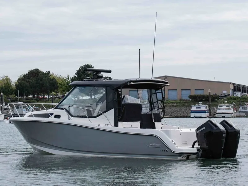 Slide: The Image of 2026 Boston Whaler 325 Conquest boat in harbor. - 2