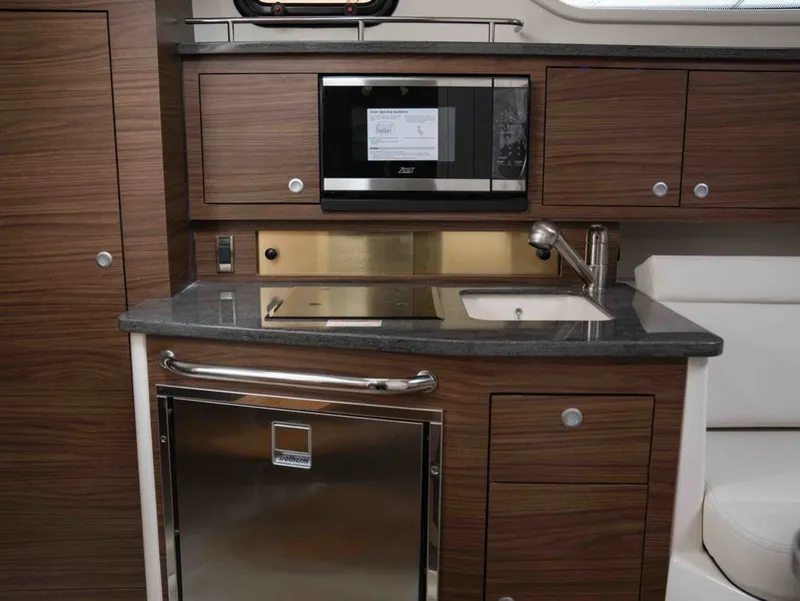 Slide: The Image of Interior of 2026 Boston Whaler 325 Conquest featuring modern kitchen. - 20