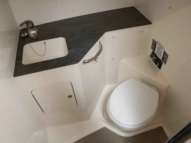 Slide: The Image of Interior of 2026 Boston Whaler 325 Conquest with sink and toilet. - 22