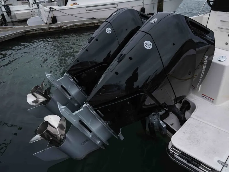 Slide: The Image of Boston Whaler 325 Conquest 2026 with powerful outboard engines. - 23
