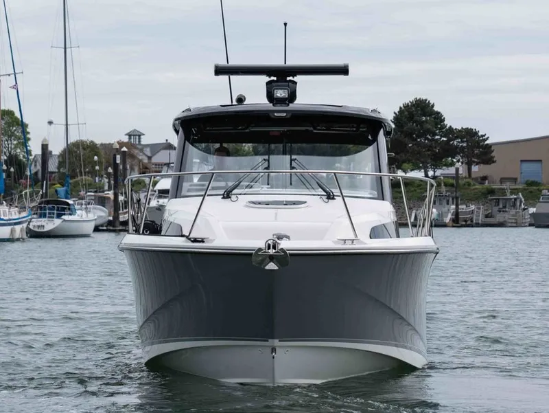 Slide: The Image of 2026 Boston Whaler 325 Conquest boat in harbor. - 3